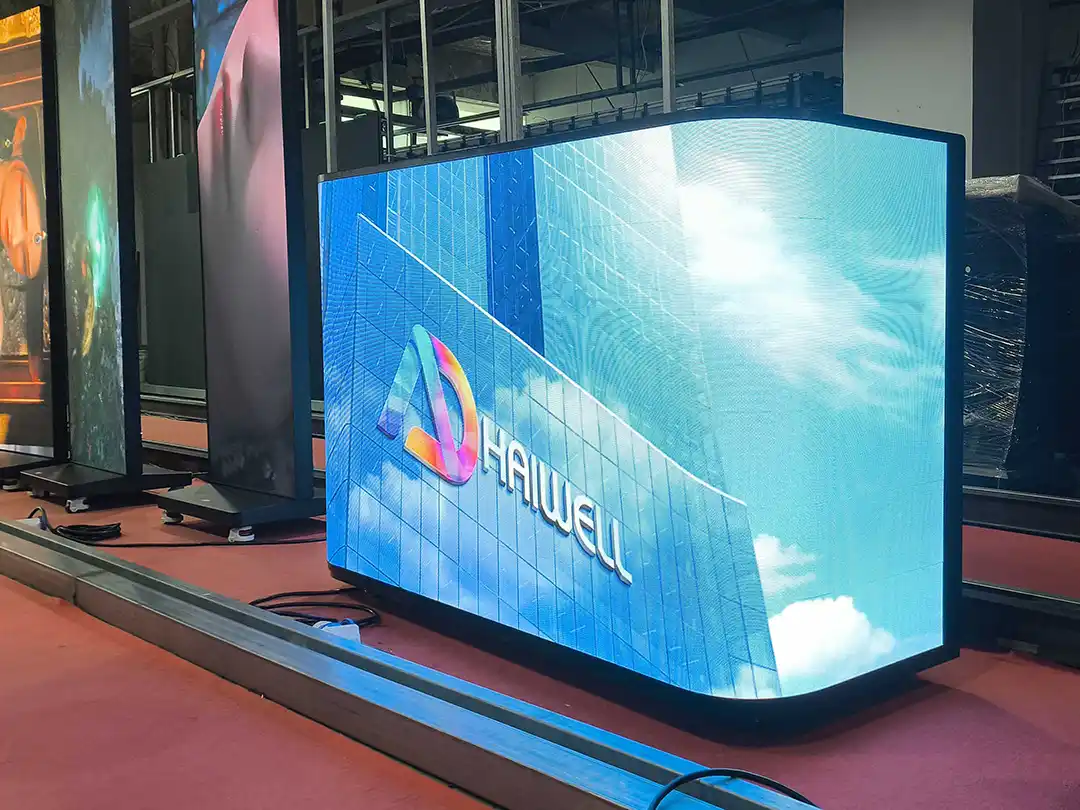 `Adhaiwell front desk counter curved LED display from China factory supplier, all‑in‑one reception digital screen playing corporate promotional video for lobby and exhibition counter marketing`