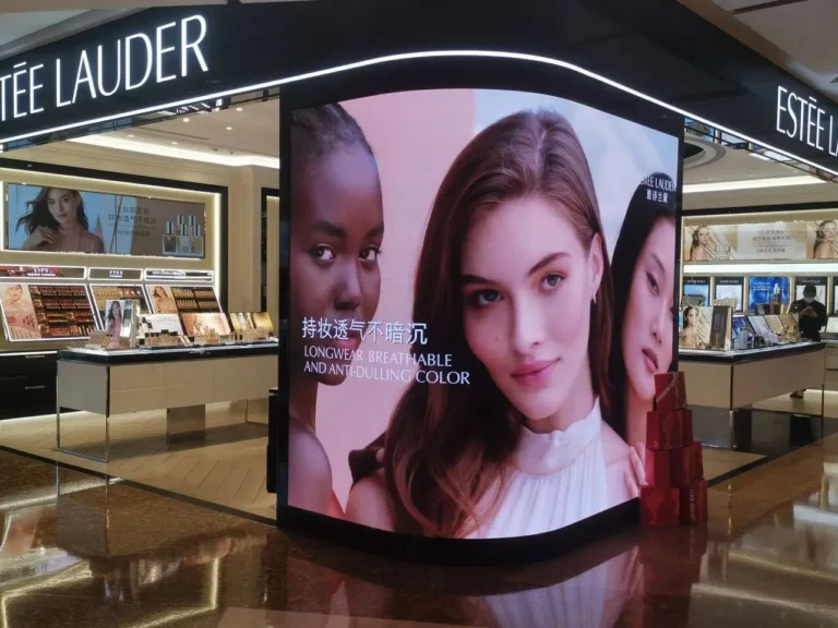 Curved Adhaiwell LED display in Estée Lauder flagship store, showcasing high-resolution beauty campaign content to enhance brand experience