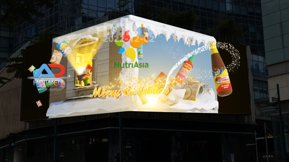 A festive L-shaped naked eye 3D LED billboard in Manila, Philippines, showing NutriAsia's Christmas anamorphic video with products popping out of a snowy window, manufactured by Adhaiwell.