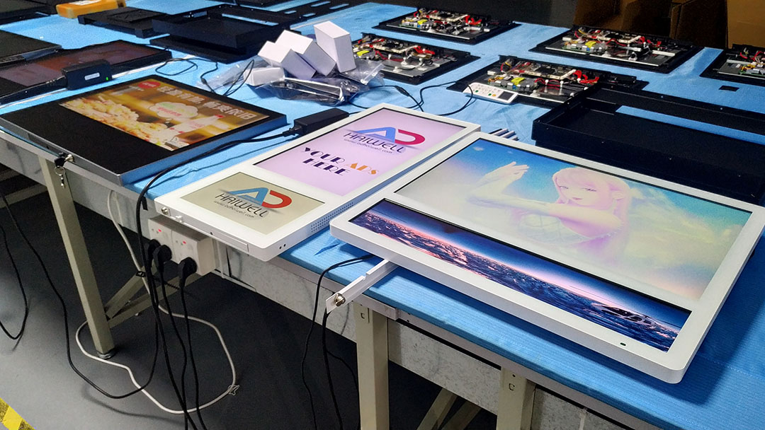 Adhaiwell elevator LCD digital signage displays under workshop burn-in quality testing by China manufacturer